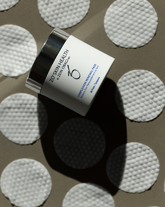Zo Skin Health product container surrounded by applicator pads