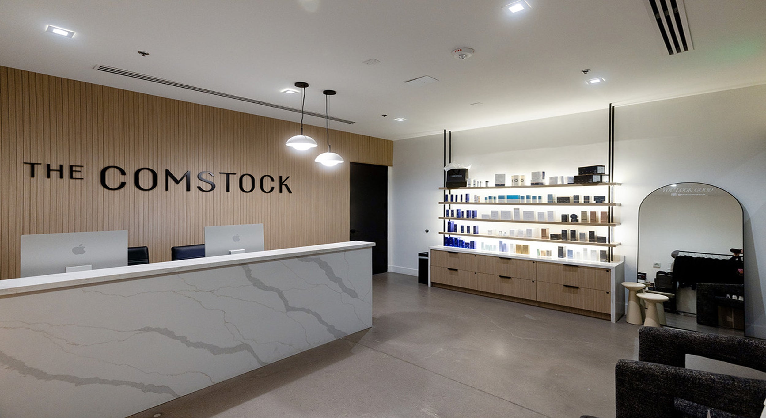 The Comstock front desk and product display shelves